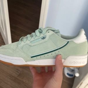 Green Adidas sneakers